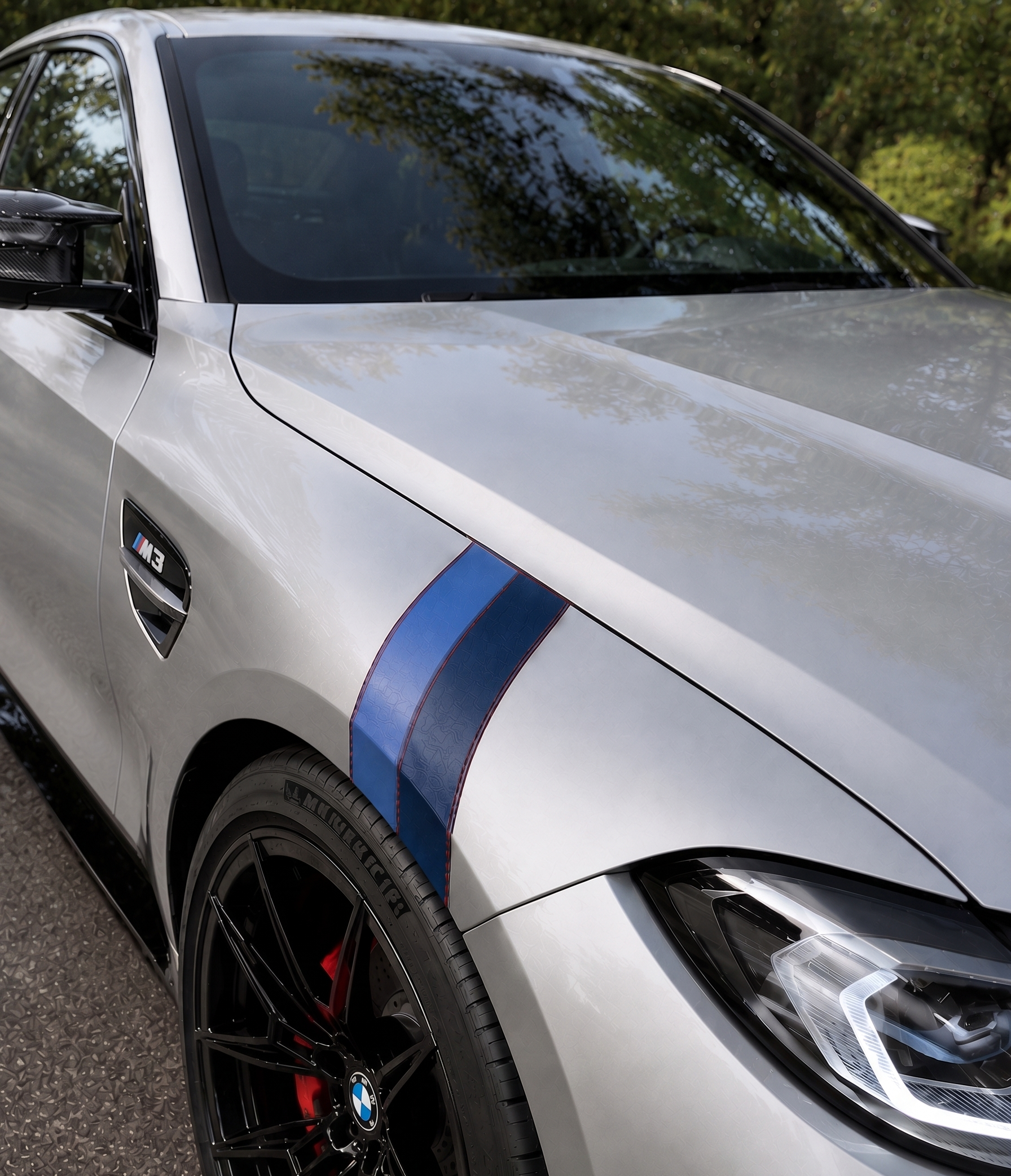 Concept with a two-tone blue leather fender accent on a silver grand tourer