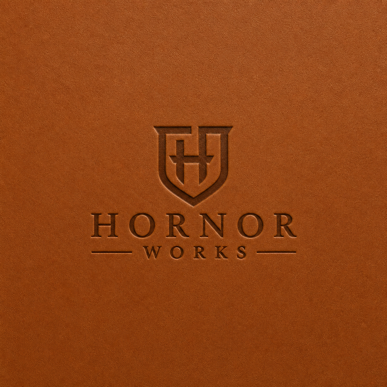 Hornor Works shield and wordmark embossed in saddle leather