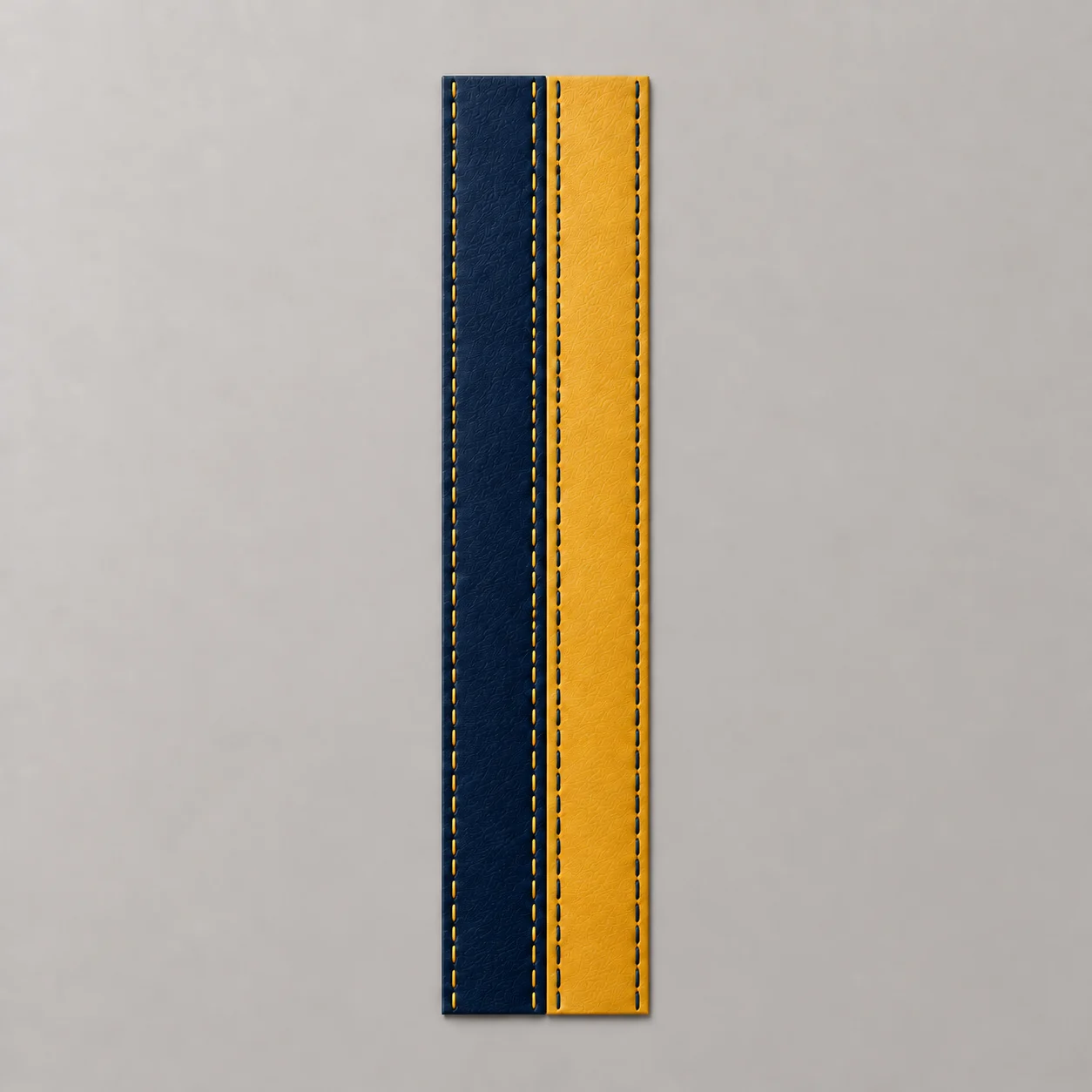 Concept render of a navy blue leather stripe with yellow stitching beside a Western Gold stripe with blue stitching on a neutral background